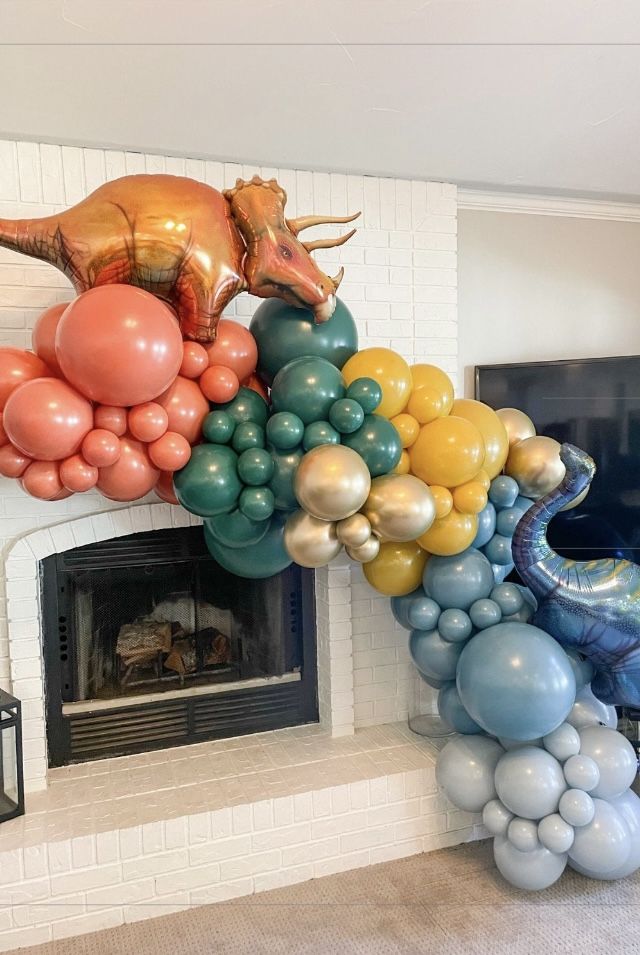 there are balloons in the shape of animals on top of each other and an animal balloon