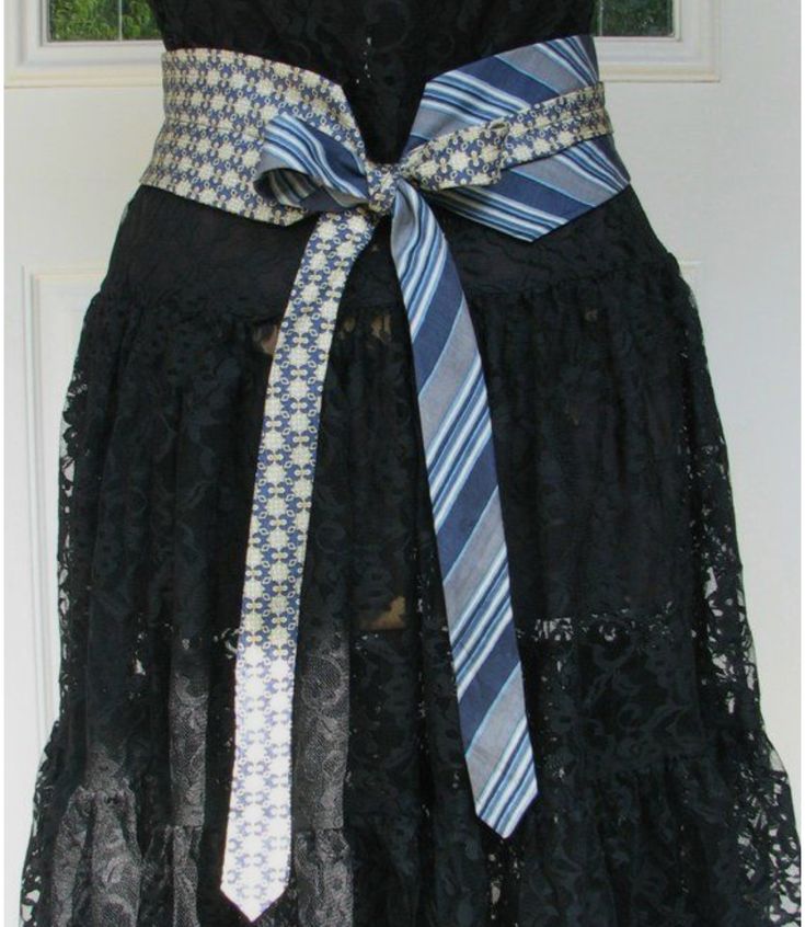 a black dress with blue and white striped ties