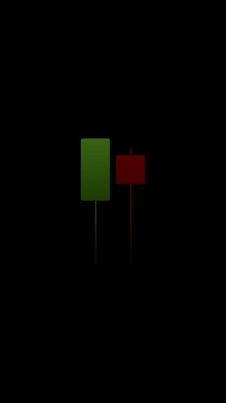 two red and green signs sitting next to each other on a black background in the dark