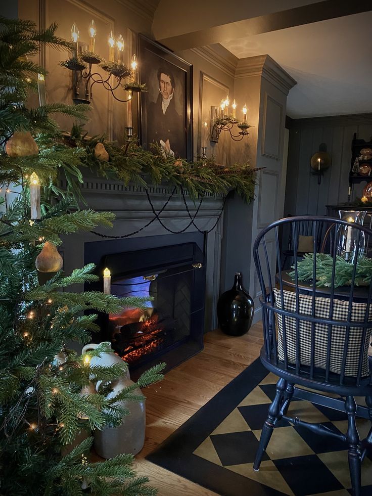 a decorated christmas tree in front of a fireplace with candles on the mantels