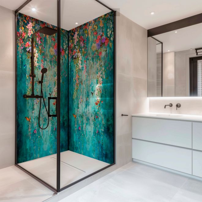 a bathroom with a shower, sink and large glass door that has flowers painted on it