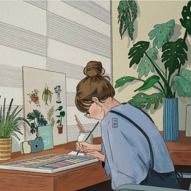 a woman sitting at a desk writing on a piece of paper next to potted plants