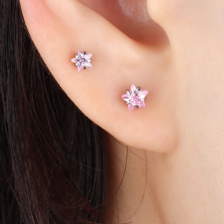 This pink star stud is a romantic and unique accessory, exuding femininity and beauty. Its subtle star design ensures it's perfect for everyday wear, while still offering a hint of sparkle. Add a touch of romance to your look with this pink star stud. Detail： -Post material: stainless steel -Used in healed piercings. -Tarnish proof and durable so you can wear it everyday without worry! Quantity & Measurement： -Gauge: 20g | 0.8mm-Post length: 6mm-Zircon diameter size: 3/4/5mm-Include: single item Elegant Pink Star-shaped Jewelry, Pink Star Charm Jewelry, Star Earring, Pink Star, Star Design, Pink Stars, Star Studs, Star Designs, Star Earrings