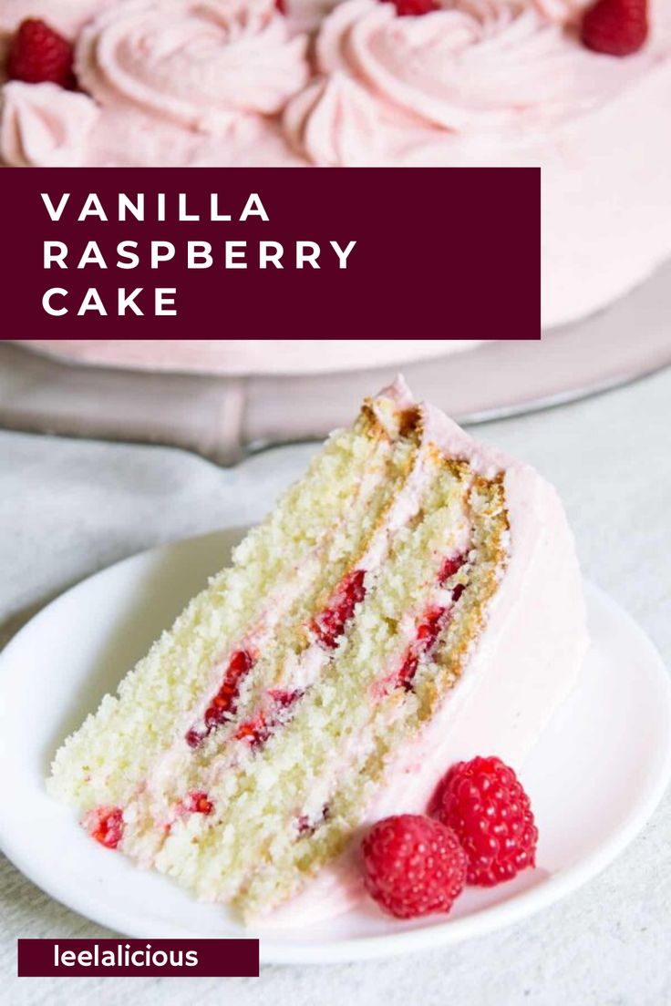 a slice of cake on a plate with raspberries and the rest of the cake in the background