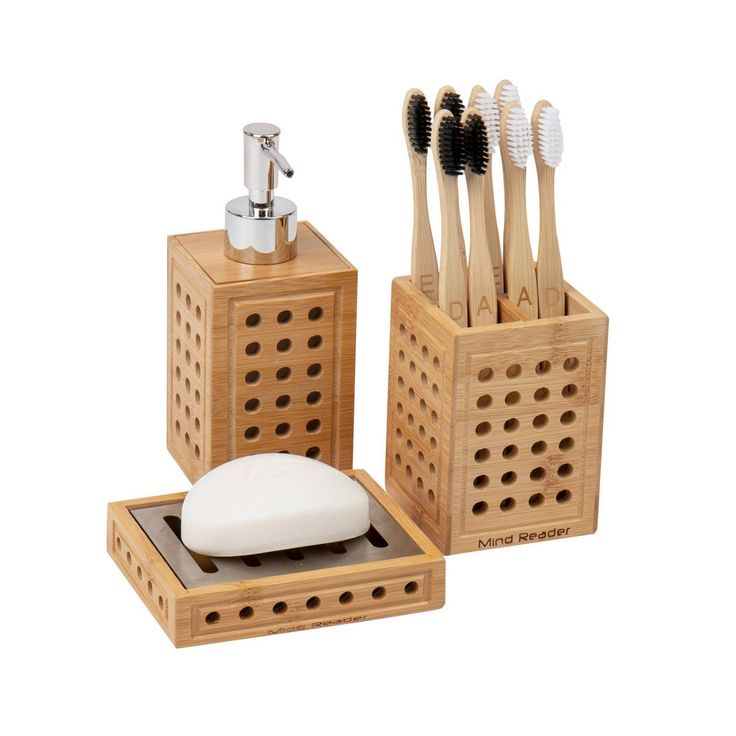 wooden toothbrush holder with soap dispenser and bamboo toothbrush holders in them