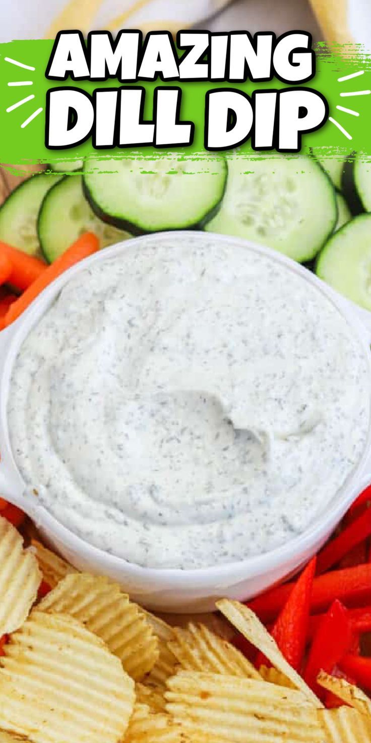 a plate with chips, cucumbers and dip on it that says amazing dill dip