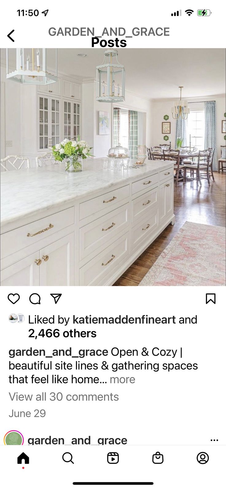 a kitchen with white cabinets and an open floor plan on the bottom right hand corner