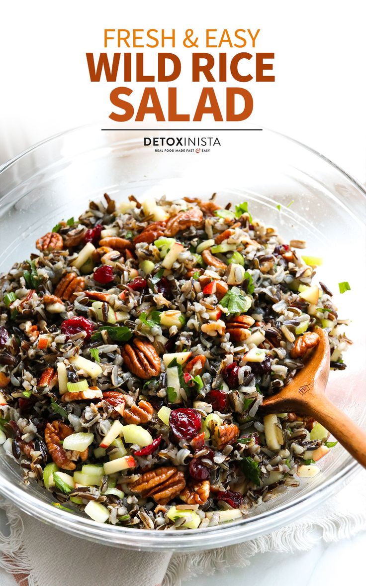 a glass bowl filled with wild rice salad