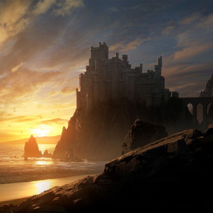 an image of a castle on the beach at sunset