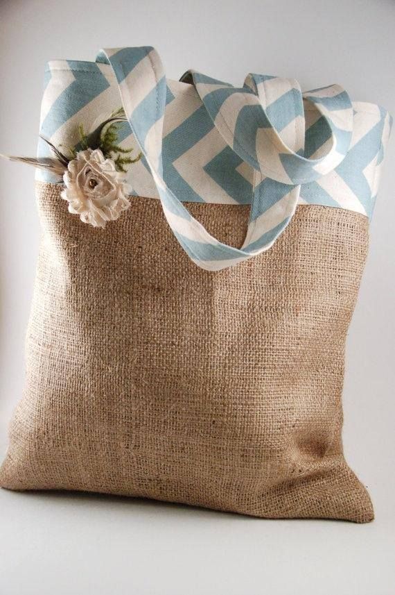 a burlap bag with a flower on it sitting on top of a table