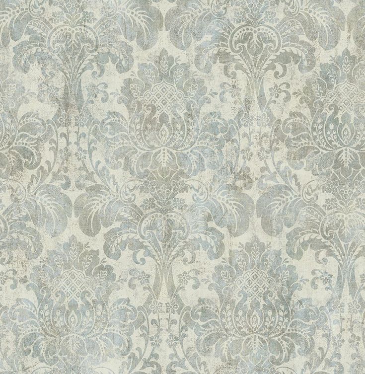 a blue and white wallpaper with an ornate design