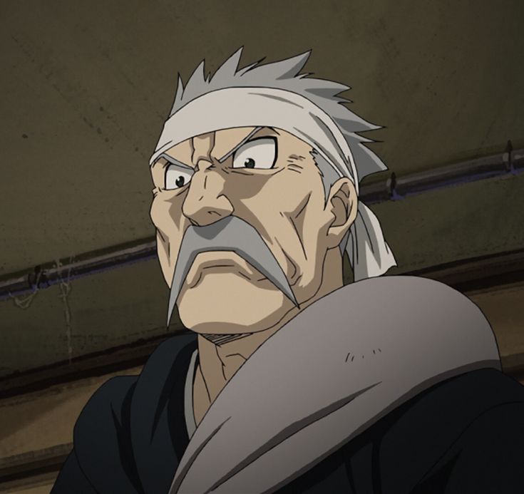 an older man with white hair and grey eyes stares into the distance while standing in front of a wall