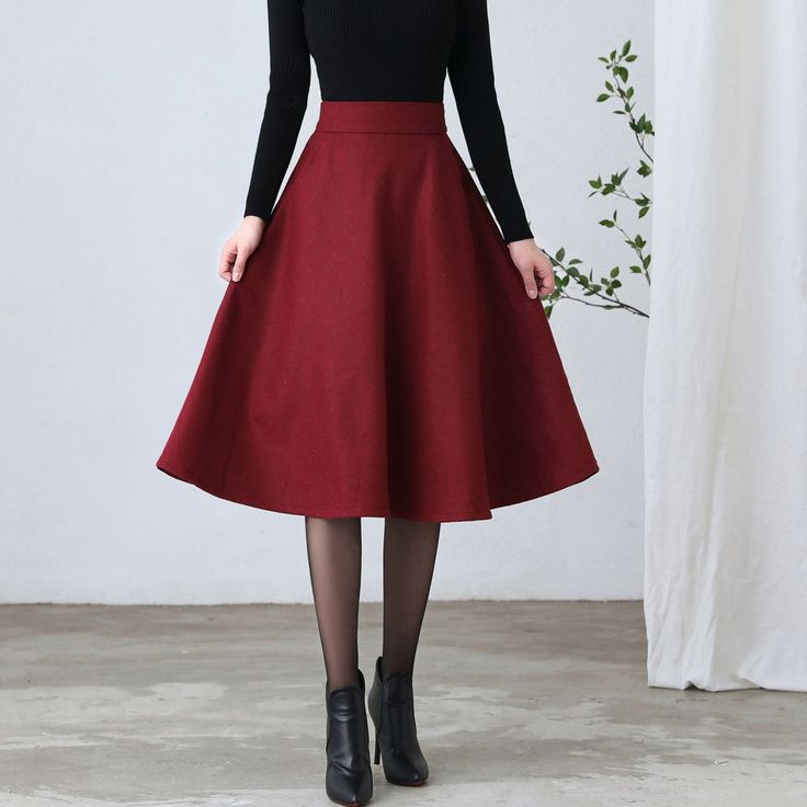 "★★ FEATURES * Wool skirt * Polyester lining * Two side pockets * Right zipper closure * back little elastic waistband * A Line wool Skirt * Midi wool sirt * Perfect for Winter, autumn * Dry clean ★★ The model is 170 cm (5′ 7″) tall with a 80 cm (31.5\") bust, 66 cm (26\") waist. She is wearing the burgundy wool skirt in size XS. ★★ Please select custom order according to the follow situation Your height is not between 155 cm- 175 cm Your weight is over 75 kg Request the length Reequest other co Winter A-line Solid Color Bottoms, Winter A-line Bottoms In Solid Color, Solid Long Pencil Skirt For Fall, Winter Solid Color Mini Skirt, Winter Lined Midi Pencil Skirt, Red Long Skirt For Fall, Classic Flared Mini Skirt For Fall, Red Winter Skirt With Relaxed Fit, Fall Red Lined Skirt