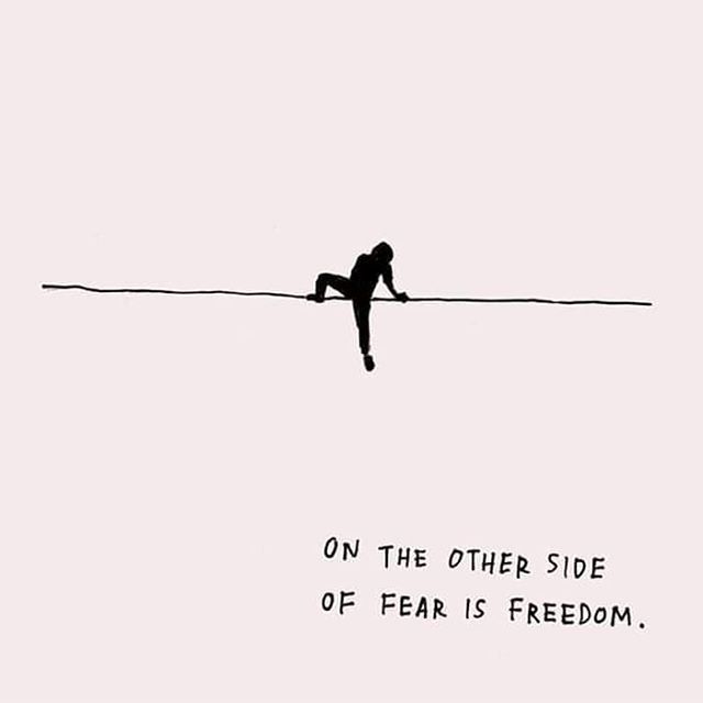 a person on a tightrope with the words on the other side of fear is freedom