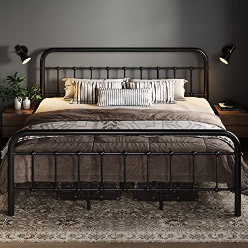 a bedroom with a metal bed frame and pillows