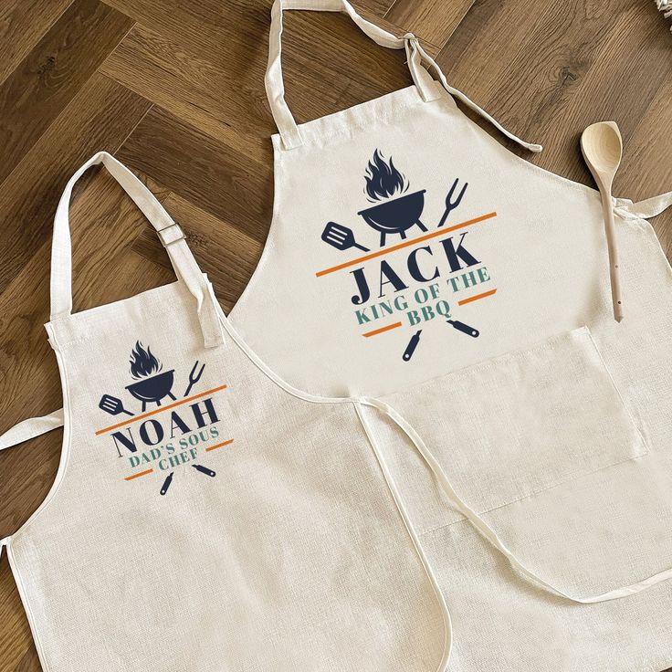 two aprons that have cooking utensils on them