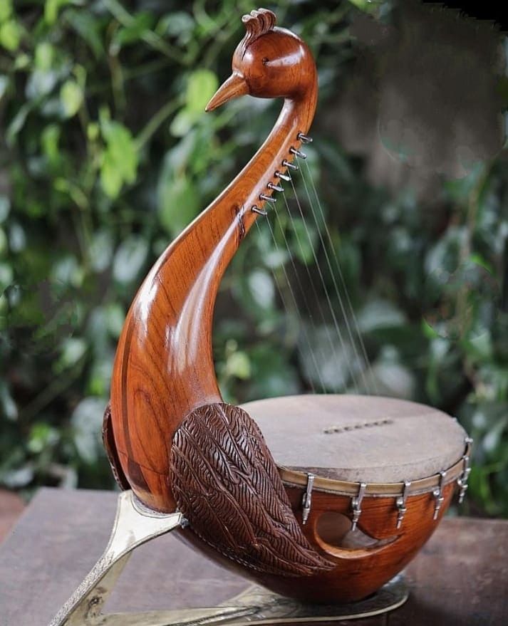 a wooden musical instrument sitting on top of a table