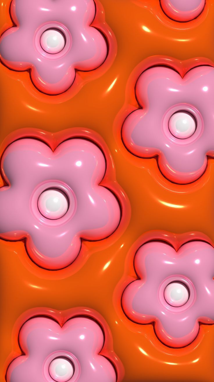 pink flowers are floating on an orange surface