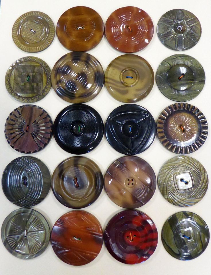 a group of glass plates sitting on top of a white table next to each other