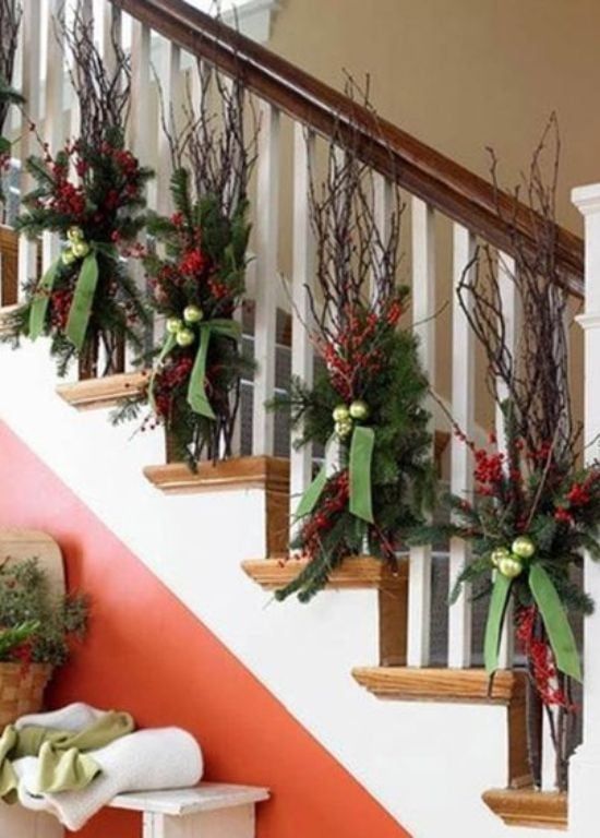 christmas decorations on the banisters and handrails are decorated with greenery