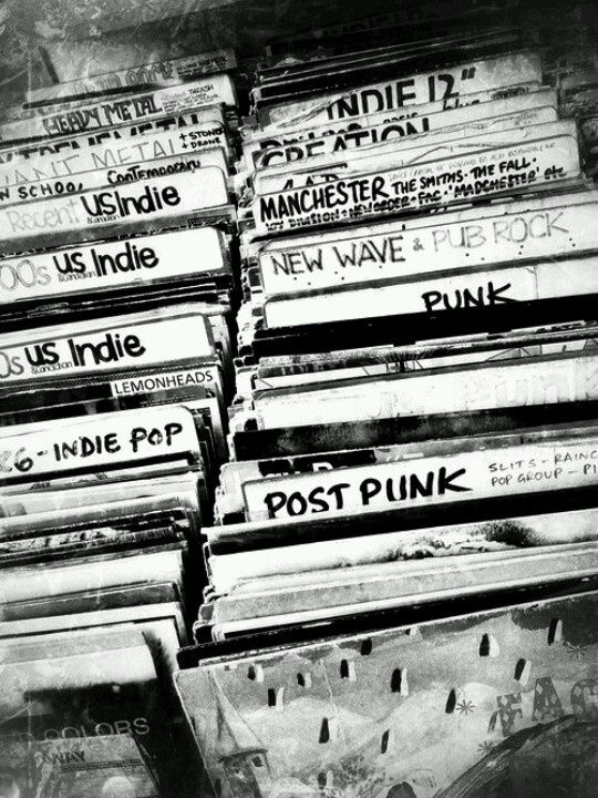 stacks of post - punk records are stacked on top of each other in black and white