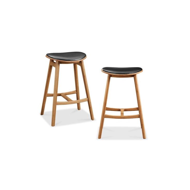 two wooden stools with black leather upholstered seat covers on each one side