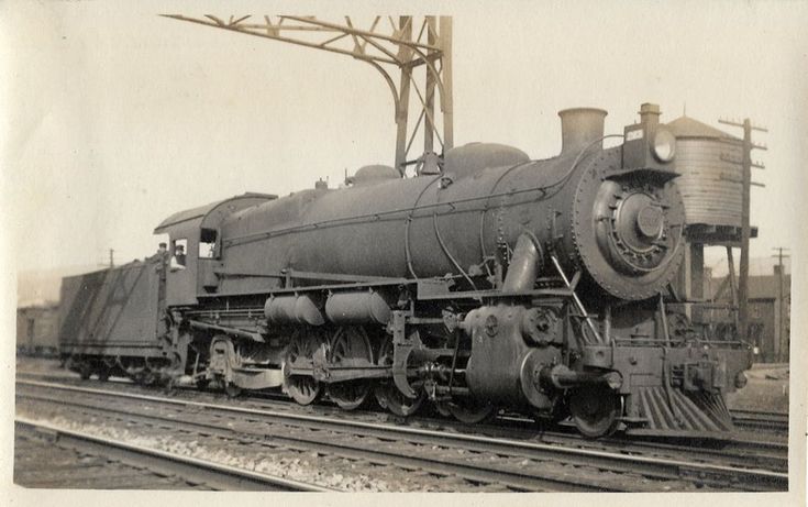 an old black and white photo of a train