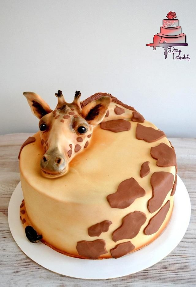 a giraffe cake is decorated with chocolate hearts