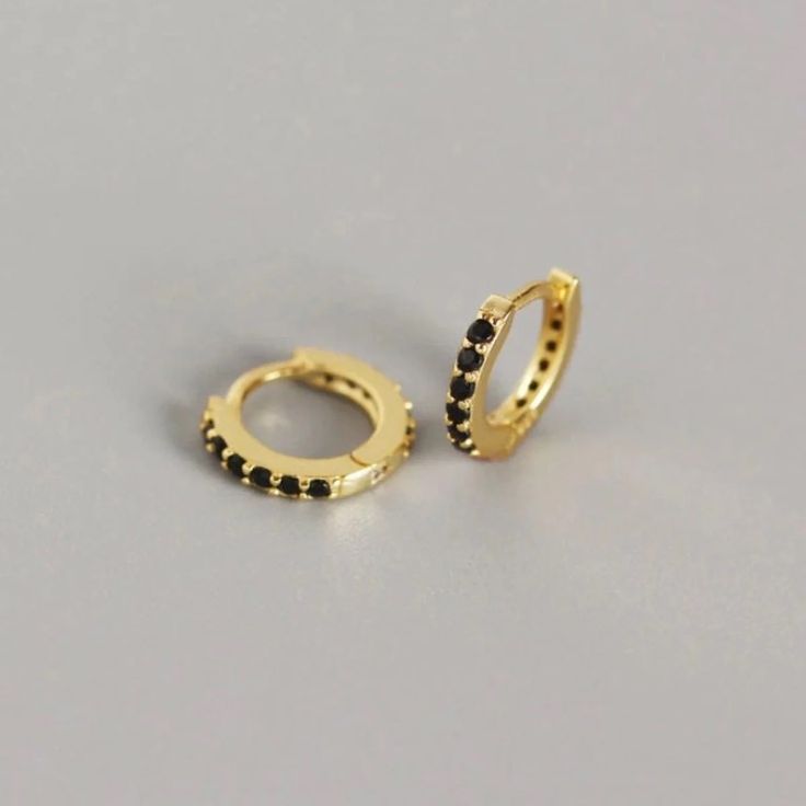 14k Yellow Gold & Black Cz Paved Huggie Hoop Earrings Price Is For 1 Pair (2 Pieces) Stone(S) Details: Stones: 11 Cz Gemstones Each (22 In Total) Stone Type: Cubic Zirconium Stone Color: Black Stone Shape: Round Stone Size: 1.5mm (Each) Stone Setting: Hand-Set Metal Details: Metal Type: Sterling Silver Metal Color: Yellow Gold Metal Finish: Beautifully Polished Karat: 14k Earring Design Details: Earring Style: Huggie Hoop Earring Back: Hinged Inner Diameter: 7mm Outer Diameter: 10mm Dainty Hoop Earrings, Ear Earrings, Sterling Silver Hoop Earrings, Huggie Earrings, Black Earrings, Delicate Earrings, Huggie Hoop Earrings, Stunning Jewellery, Sterling Silver Hoops