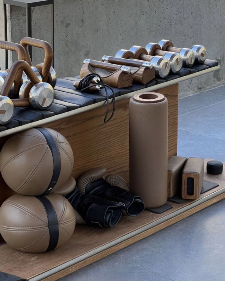 an assortment of sports equipment is displayed on a shelf