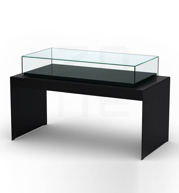 a black table with a glass top and metal legs