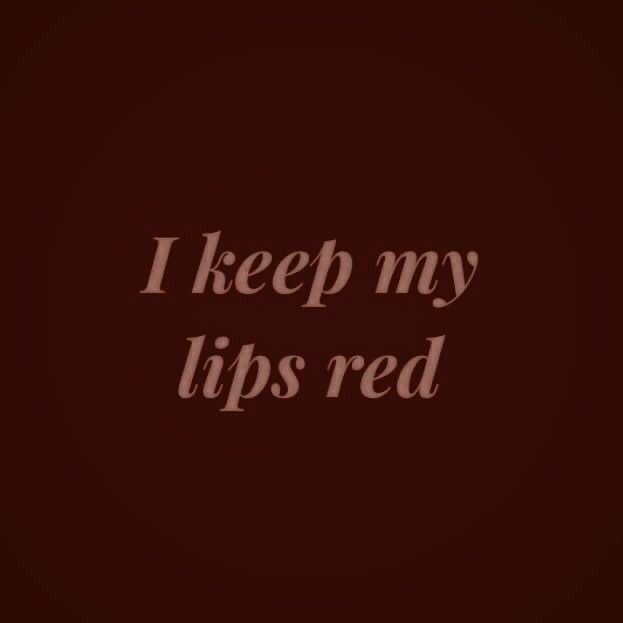 the words i keep my lips red are shown in white on a dark brown background