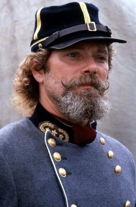 a man with a beard wearing a uniform