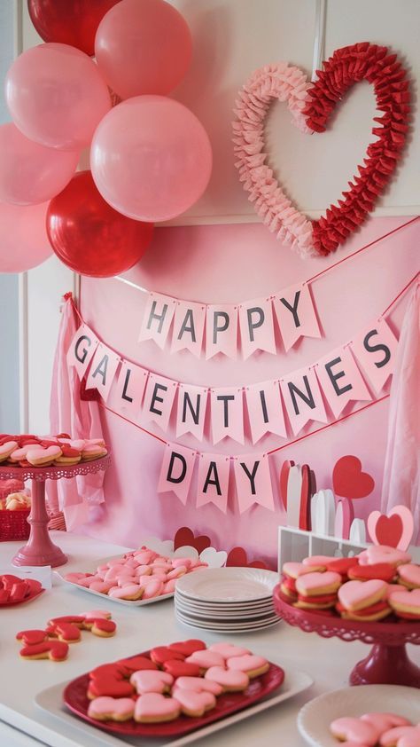 a valentine's day dessert table with heart shaped cookies and pink frosted doughnuts