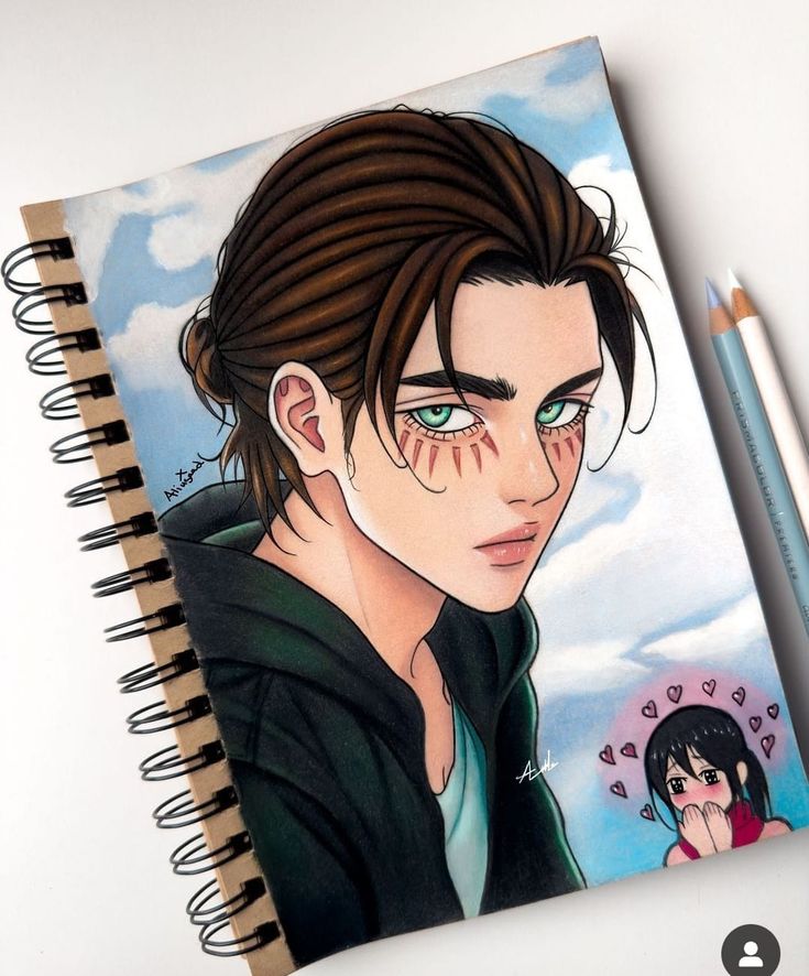 a drawing of a young man with green eyes next to a spiral notebook and pencil