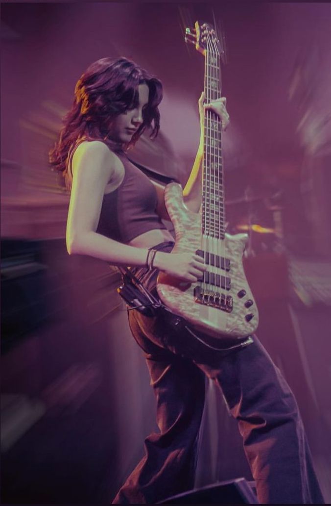 a woman playing an electric guitar on stage