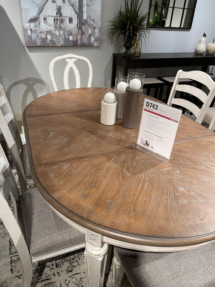 Bon appétit. This dining room extension table has all the right ingredients for a French country-inspired feast for the eyes. Antiqued two-tone aesthetic pairs a chipped white with a distressed wood finished top for a double serving of charm. Style: Casual Color: Chipped White Rectangular Table Features: Made of veneers, wood and engineered wood with some cast resin components Antiqued two-tone finish Separate extension leaf Table extends by pulling both ends and dropping in leaf Seats up to 8 Dining chairs sold separately Assembly required Dimensions: 42" W x 96" L x 30" H Apron to floor : 25.88" Leaf : 18" Table length without leaf : 78" Table length with leaf : 96" Weight : 158 lbs. Assembly Instructions Round/Oval Table Features: Made of veneers, wood and engineered wood Antiqued two-t Round Dining Room Table With Leaf, Round Dining Room Table Decor, Modern Round Dining Room Table, Dining Room Extension, Oval Kitchen Table, Round Dining Room Table, Room Extensions, Dining Room Table Decor, Extension Table