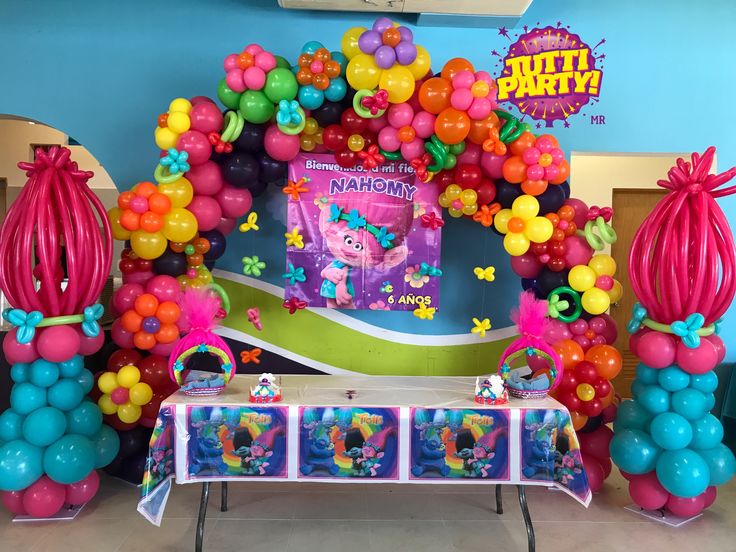 the balloon arch is decorated with colorful balloons