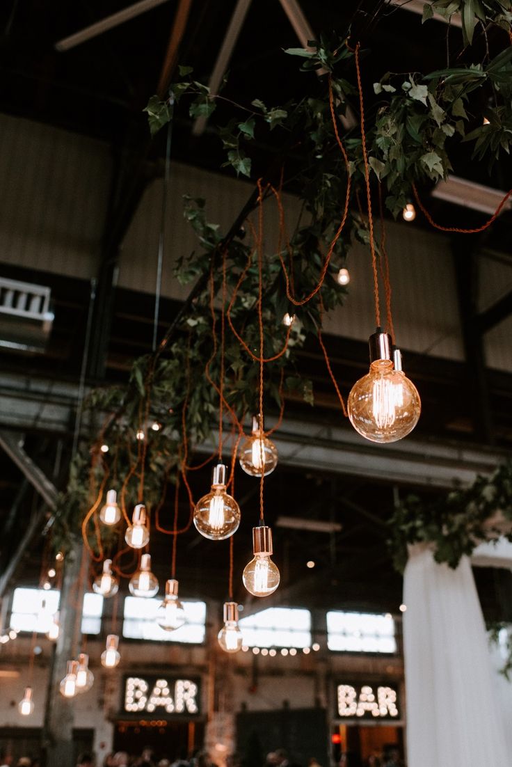 several lights hanging from the ceiling in a restaurant