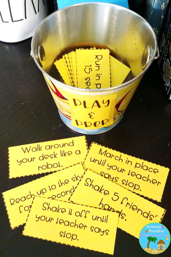 four yellow sticky notes sitting on top of a table next to a bucket of soda