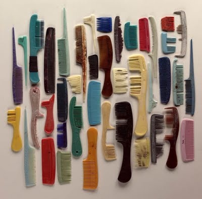 there are many different colored combs on the wall