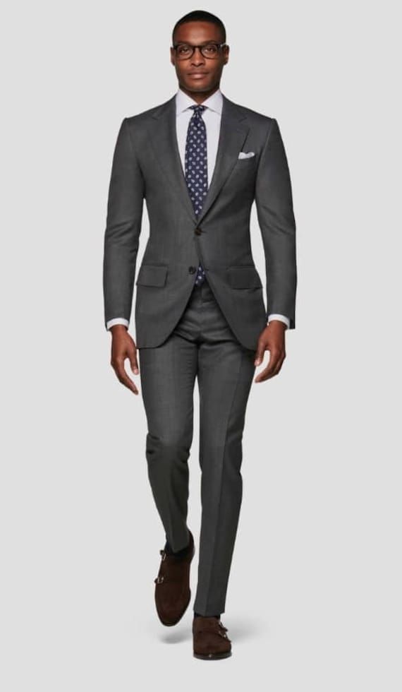 Are you planning a wedding or other social event that you want to look good and stand out in the crowd ? Then this suit is a must have.  It comes in grey color but can be customized in any color of your choice.  Product Details: 1. Grey single breasted 2 pieces (jacket,coat & pant). 2. Sewed with a blend of wool and cotton high quality fabric.  3. Comes in sizes XS to 3XL. For larger sizes, kindly contact us. 4. It is a custom order. So any specification/requirement of your choice will be added while sewing. For more perfect fit, please send the following measurements: a. Neck  b. Shoulder  c. Chest d. Sleeve  e. Belly f. Jacket length g. Waist h. Hip i. Thigh j. Knee k. Leg opening/ankle l. Pant length It is a custom order. Therefore time is needed to sew and ship it. It takes between 1 w Tailored Gray Tuxedo In Suiting Fabric, Gray Tuxedo Suit For Formal Occasions, Tailored Gray Tuxedo For Formal Occasions, Gray Tailored Tuxedo Suit, Classic Gray Suit And Tie Accessories For Wedding, Gray Notch Lapel Tuxedo For Formal Events, Gray Notch Lapel Tuxedo For Formal Occasions, Tailored Gray Suit In Suiting Fabric, Gray Three-piece Suit With Notch Lapel