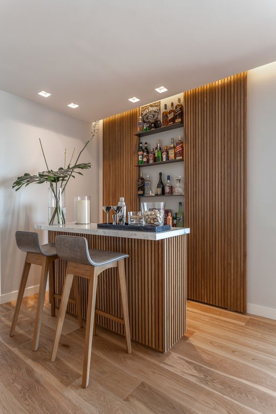 a bar with two stools in front of it