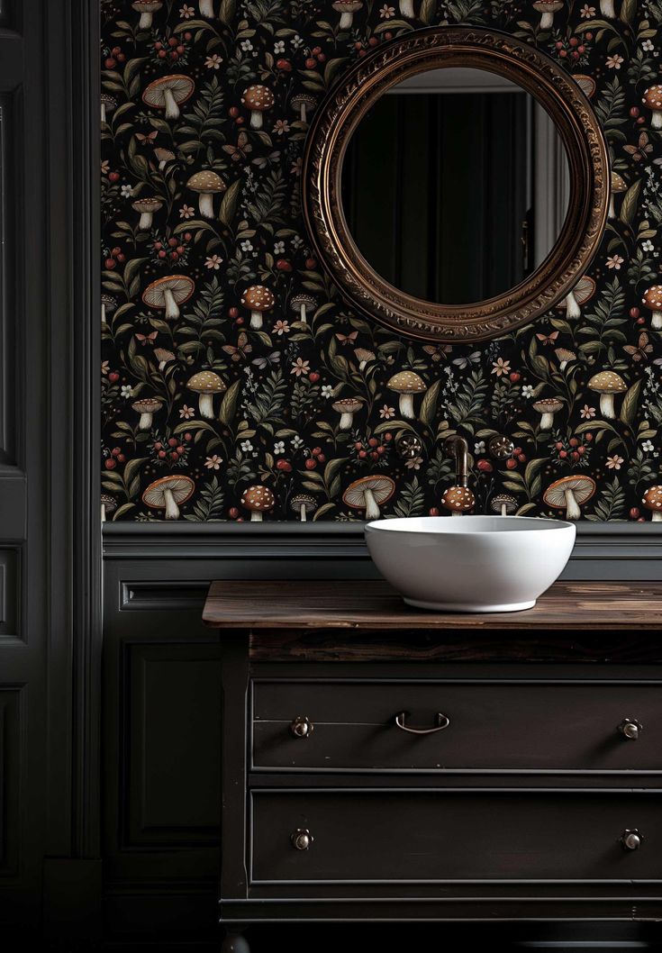 a bowl sitting on top of a wooden table in front of a wall papered with mushrooms