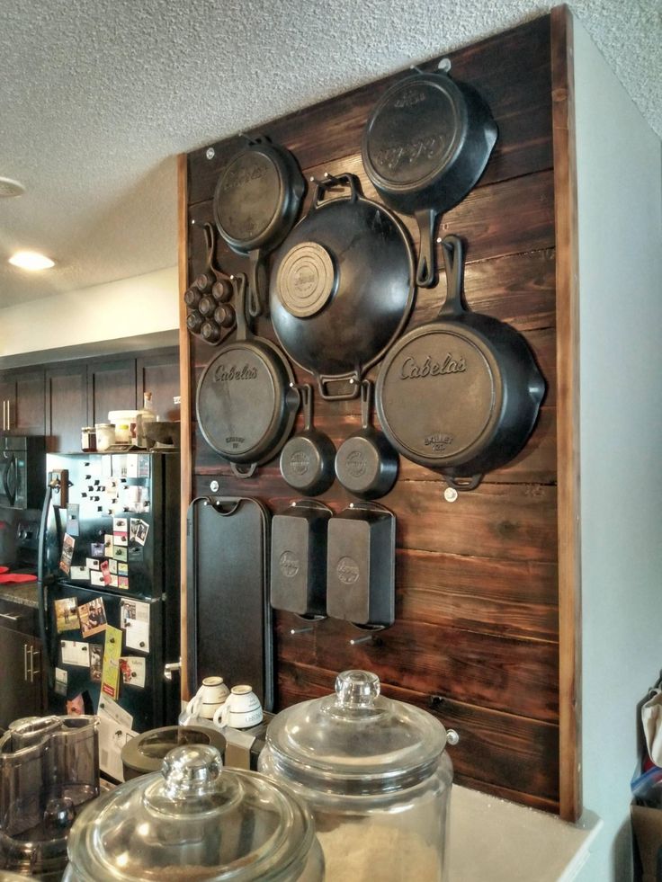 pots and pans are hanging on the wall