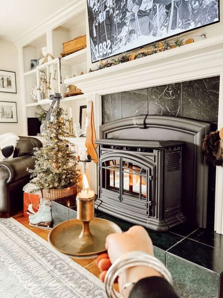 a living room filled with furniture and a fire place