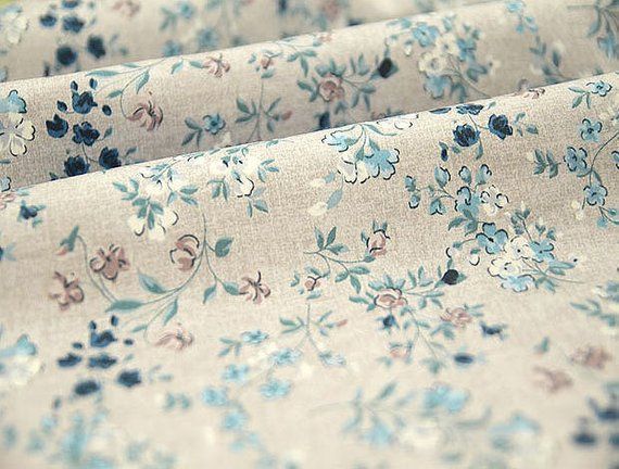 the fabric has blue flowers on it