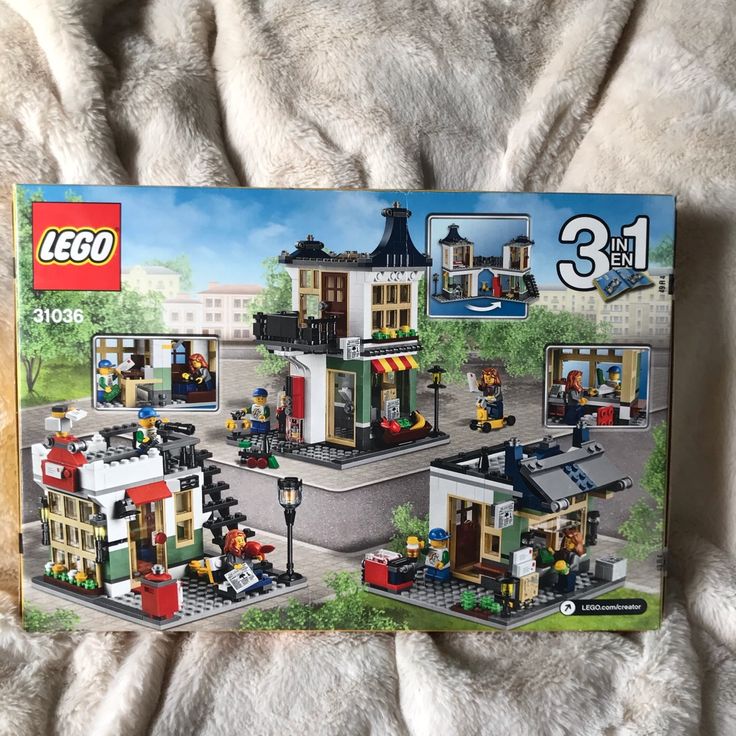 the box is open to reveal an assortment of legos in it's packaging