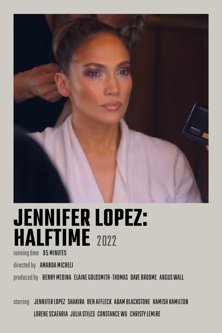 a woman is getting her hair done in front of a poster that says,'jennifer lopez half time '