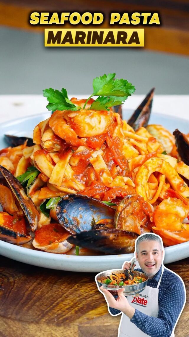 the cover of seafood pasta marinara with a man holding up a plate of food